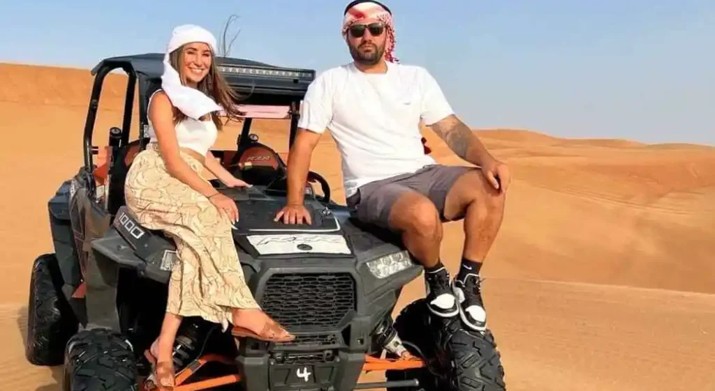 4x4 vehicle dune bashing at sunset in Abu Dhabi desert